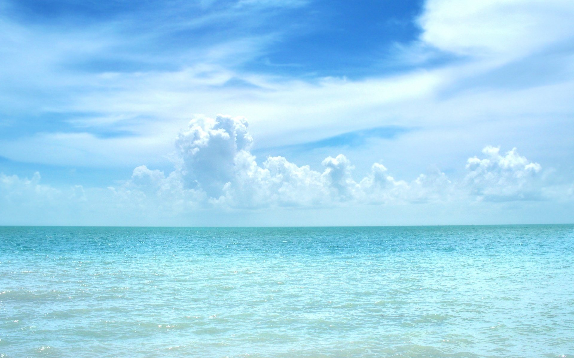 Blue sky with clouds on the horizon of the sea