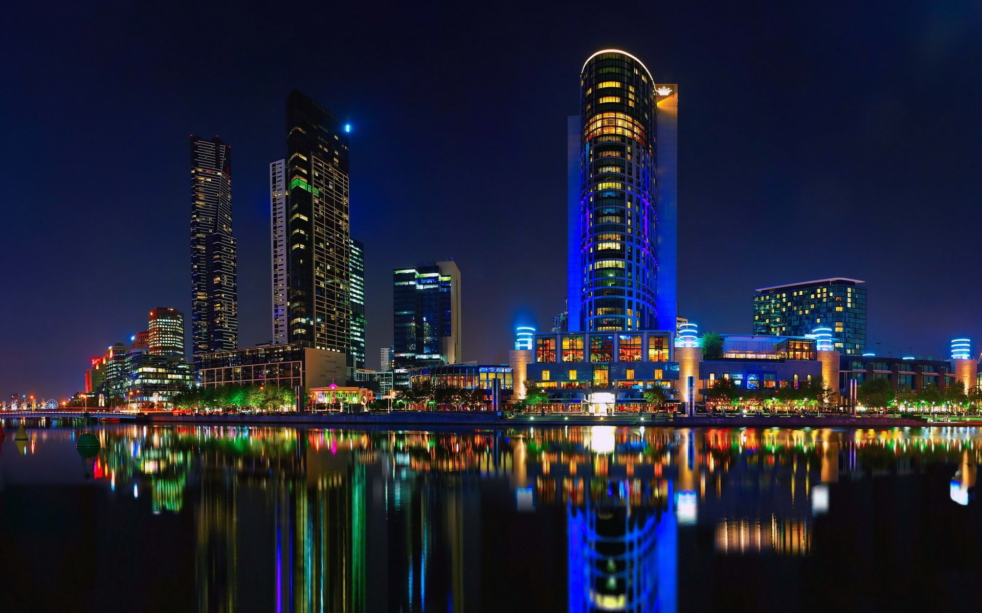 Lights of the night city with reflection in the pond