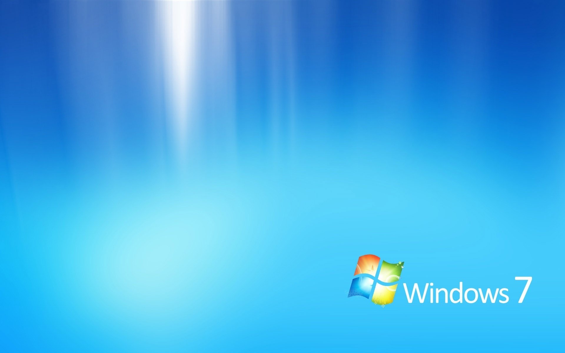 Microsoft windows 7 logo on a blue illuminated background