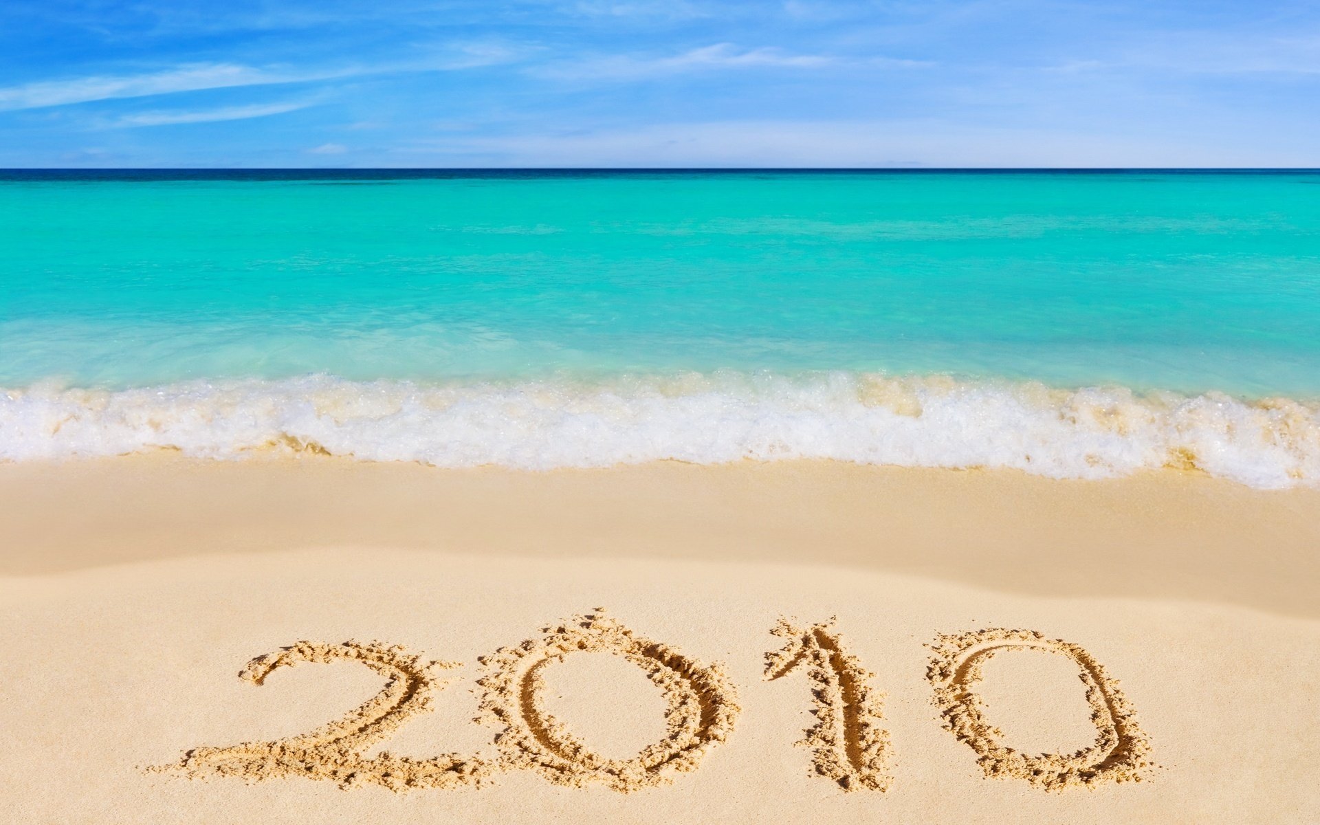 Inscription on the sand by the blue sea 2010