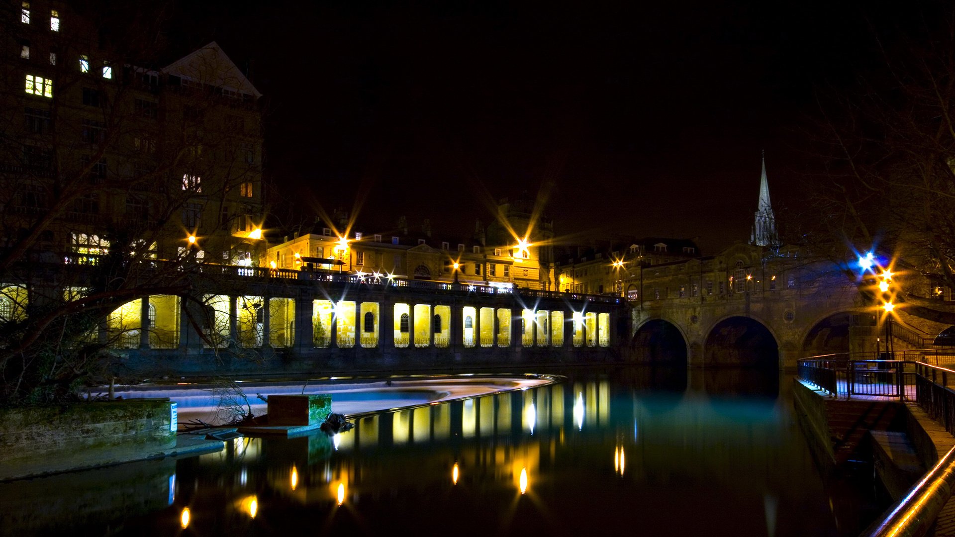 The night light of the city is reflected in the river