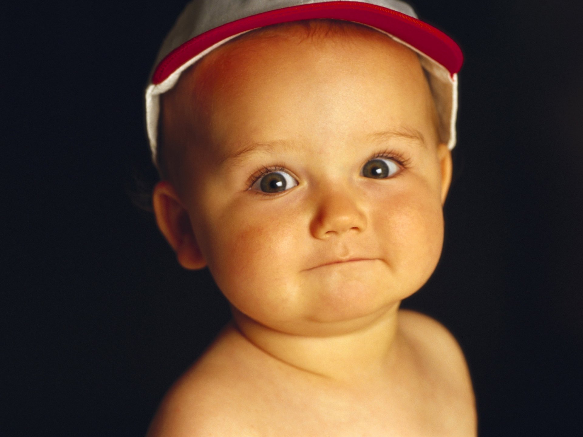 Little kinder in a colored cap