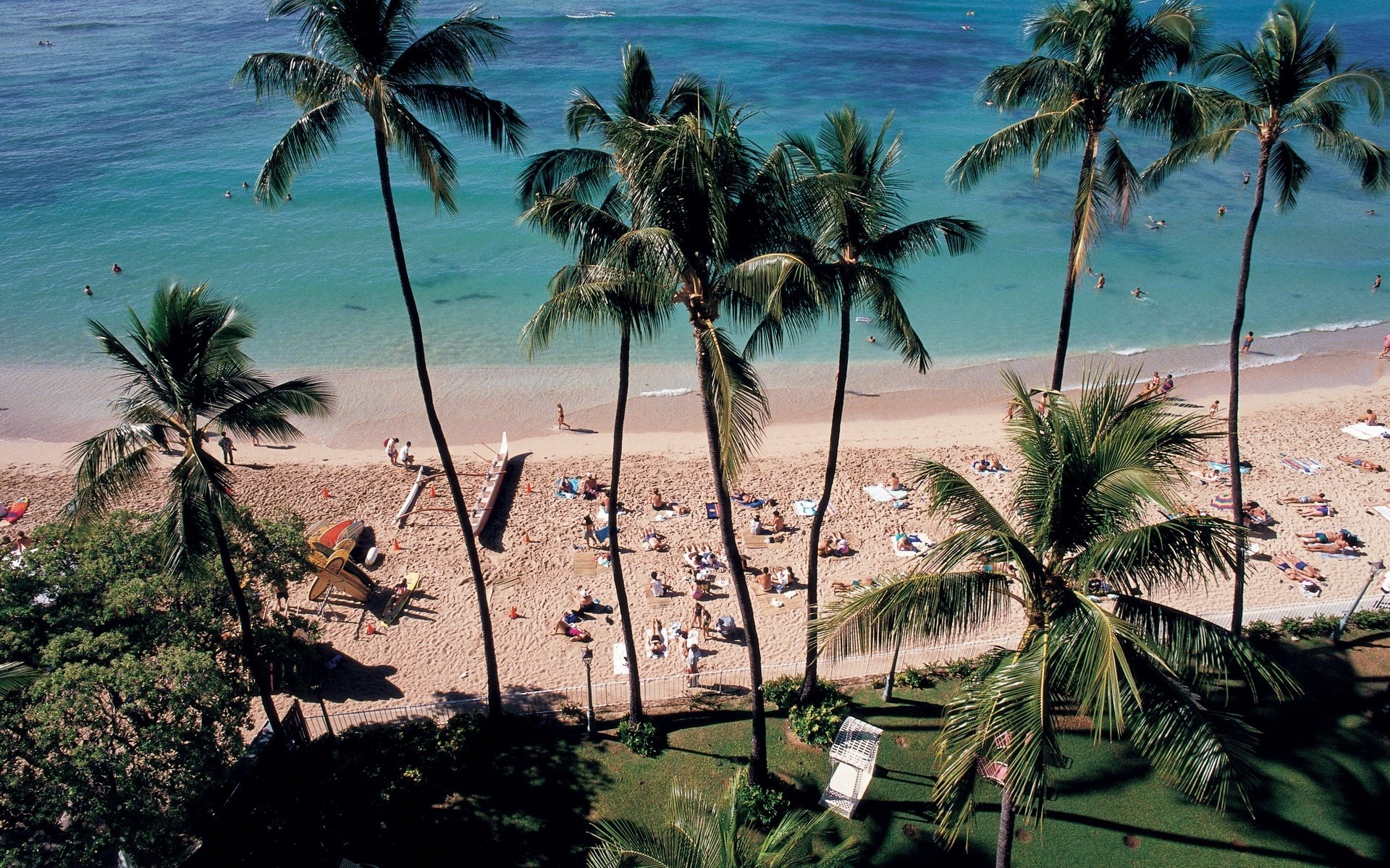 The coast of the sea. People are sunbathing