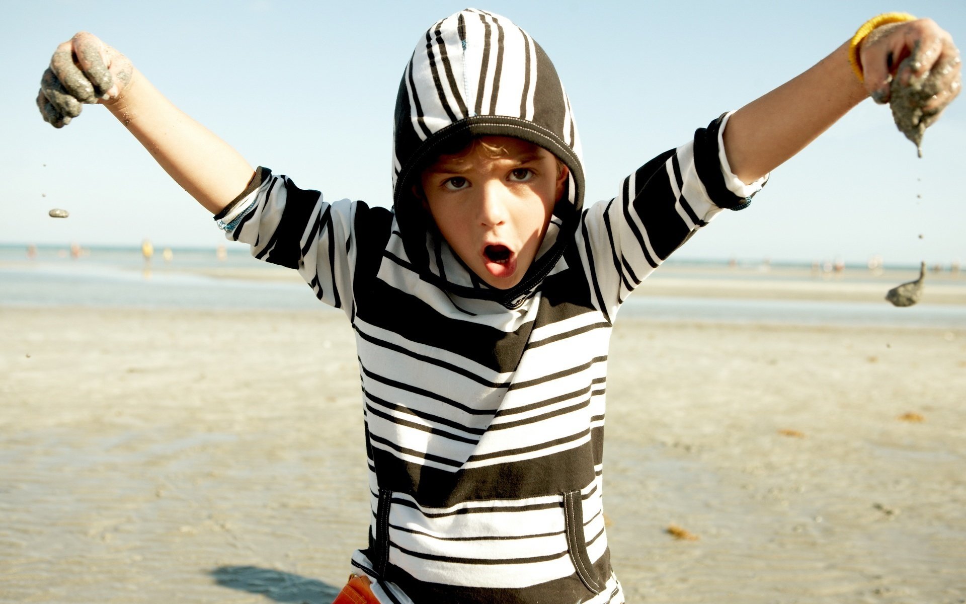 Boy child playing with sand nature