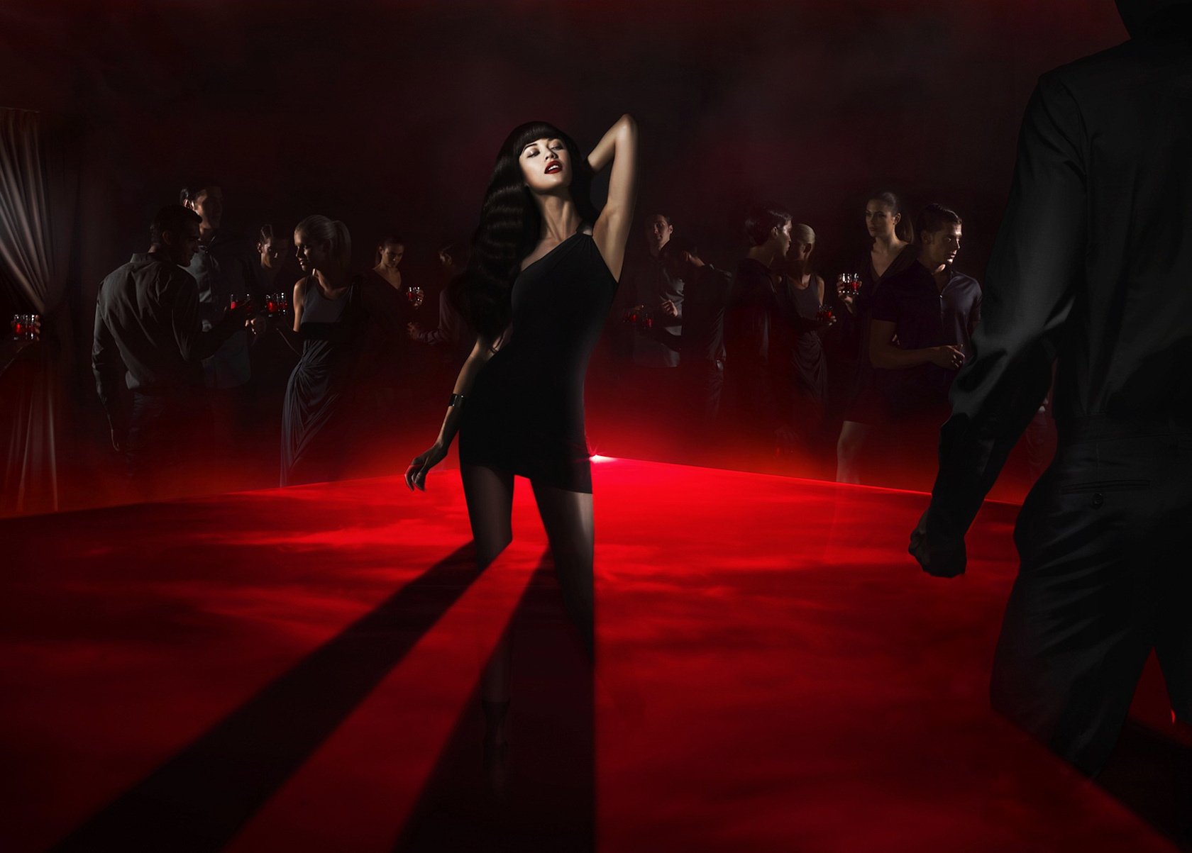 A girl in a sulfur dress dancing in the dark