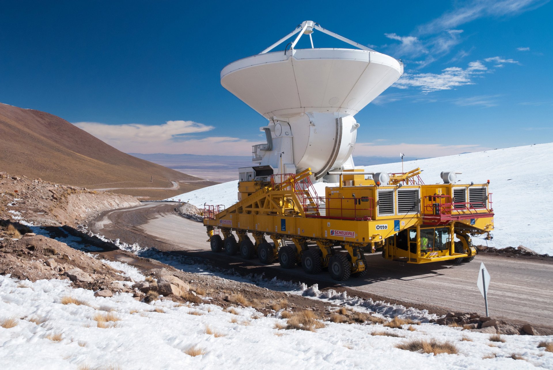 alpine plateau chajnantor desert atacama north chile track 14x2- wheel special tractor transporter power installation pulls antenna is the large in the world radio telescope height 5000 m n / levels s