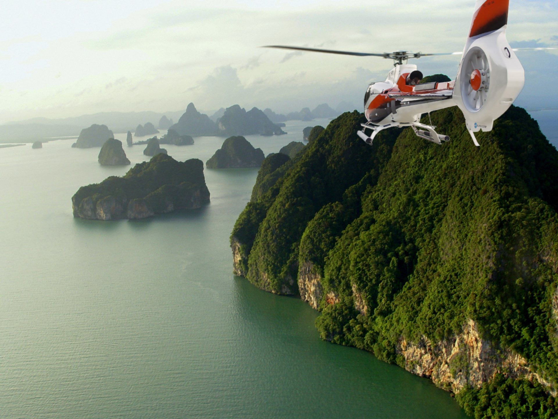 Helicopter on the background of green, mountainous islands