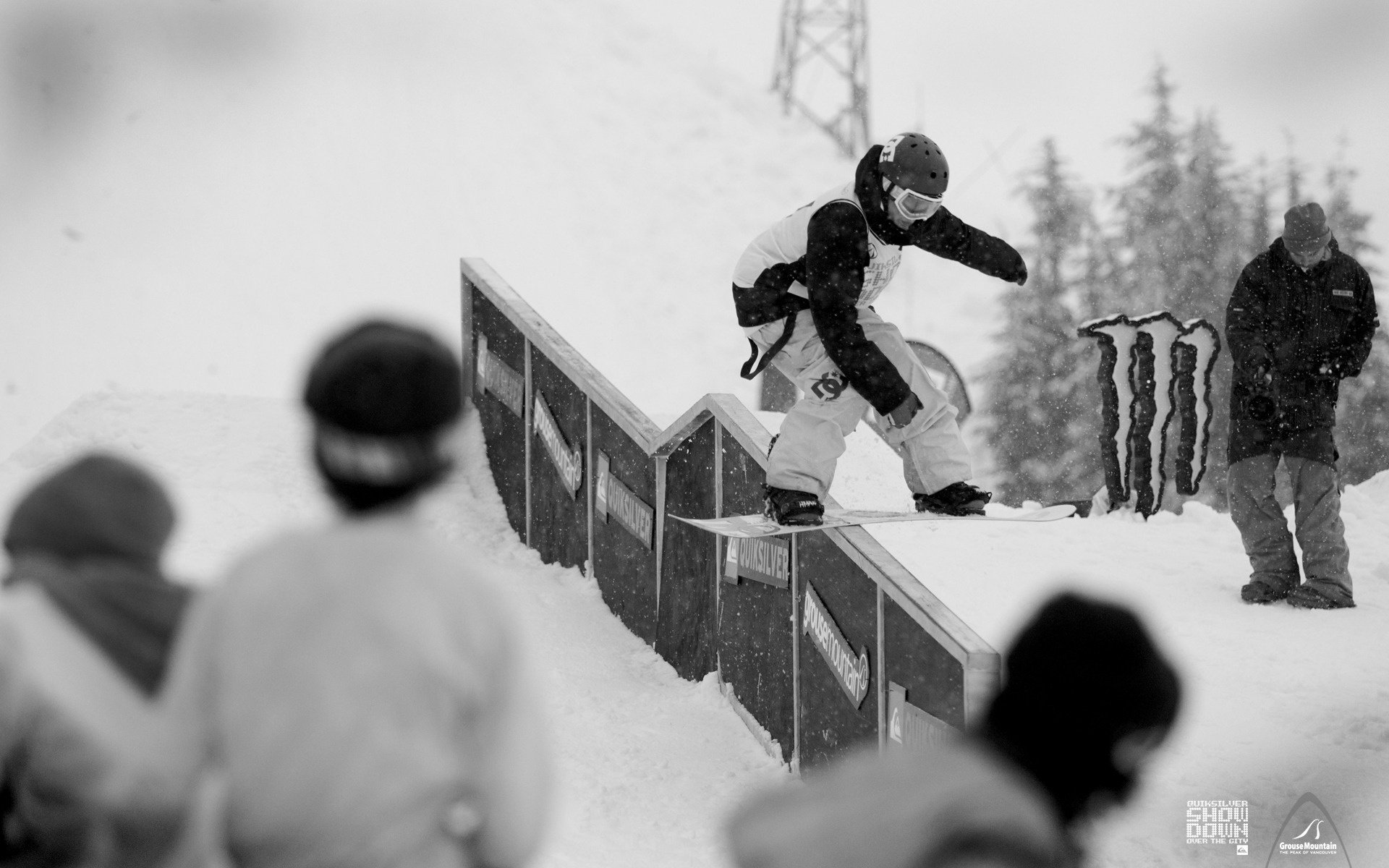 Black and white photo of guys at snowboarding competitions