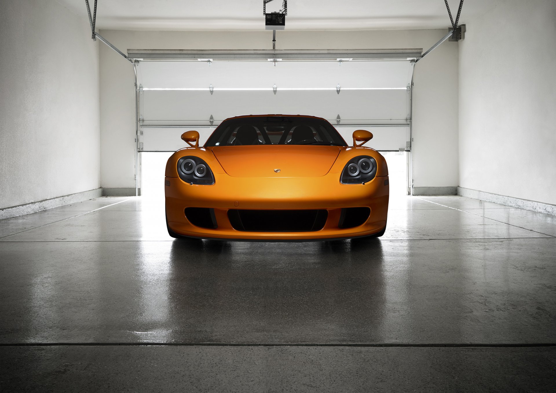 porsche carrera gt arancio borealis exotic supercar orange ligth nigth front garage