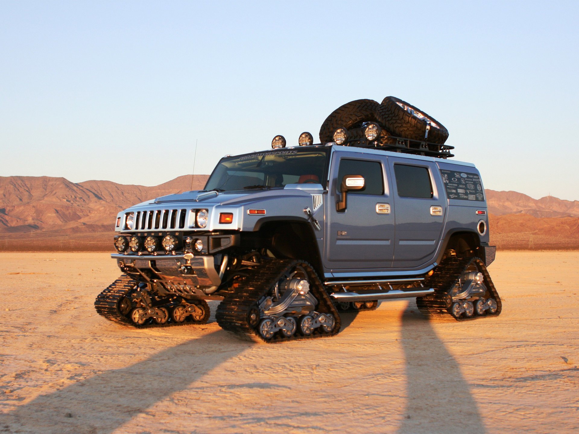 Silver Hummer all-terrain vehicle in the desert