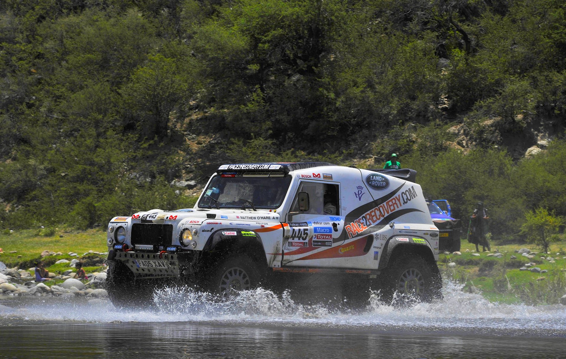 land rover defender suv dakar rally water spray white car sports
