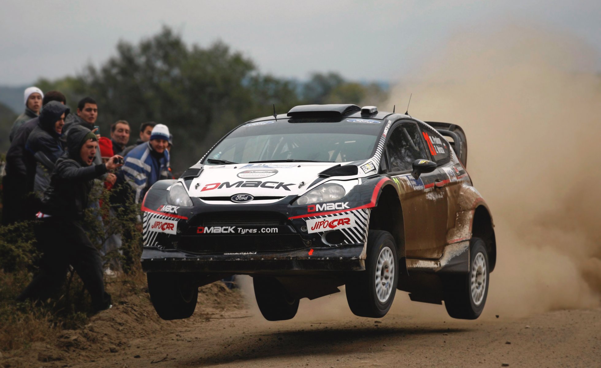 ford fiesta wrc rally car dust people in the air black speed machine sports