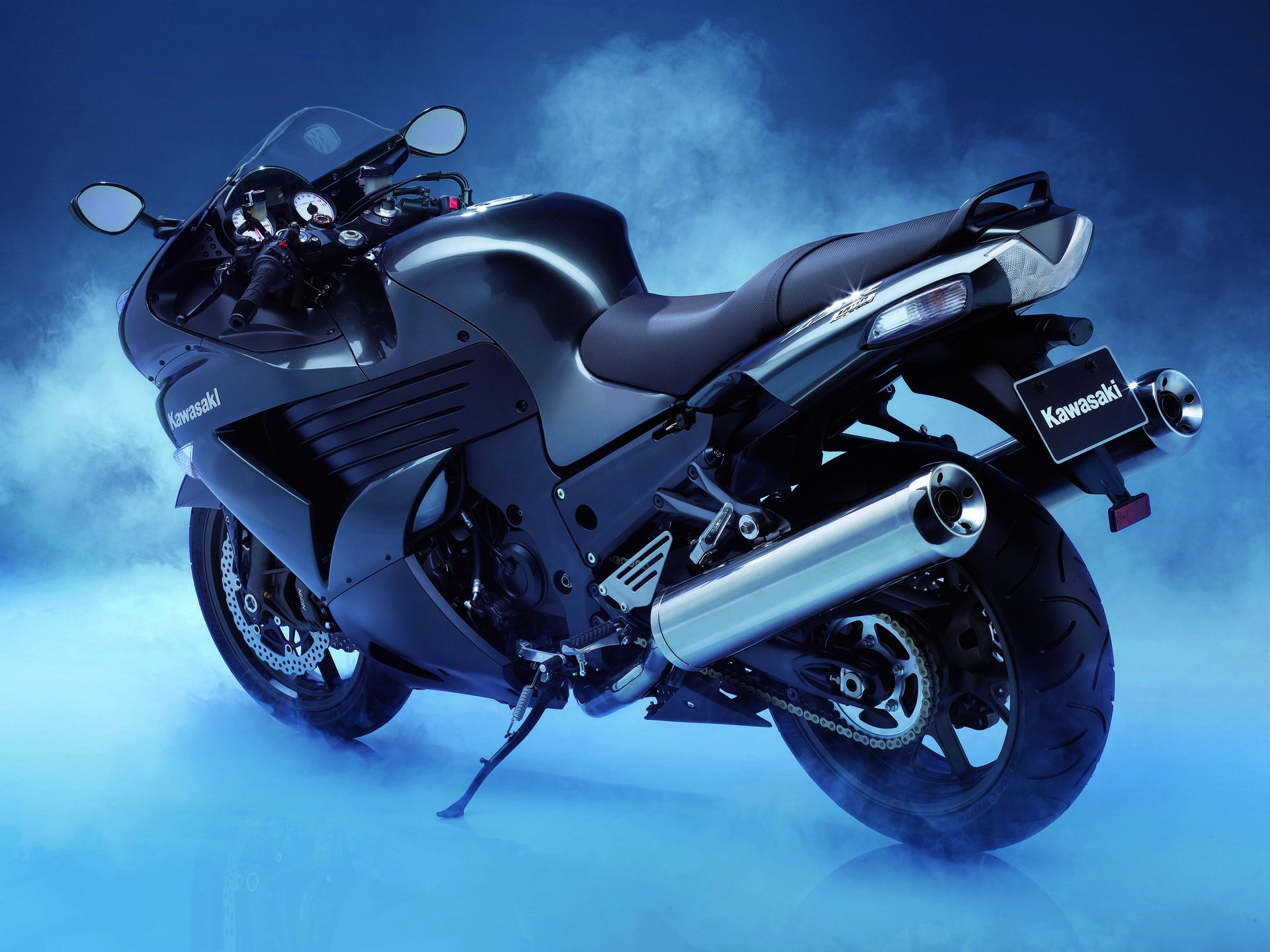 Kawasaki zzr-1400 sport bike stands in the fog on a blue background