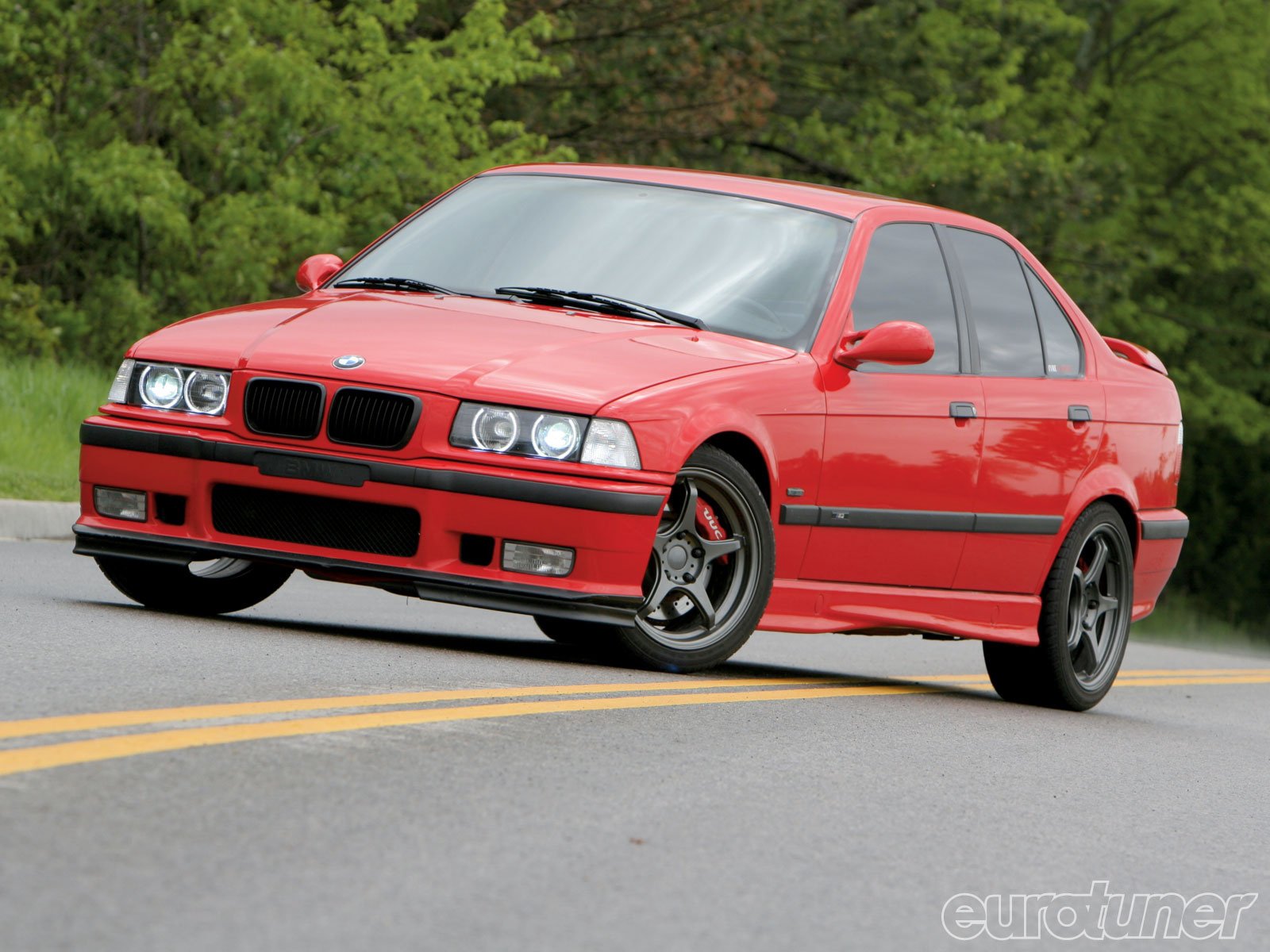 Powerful red BMW on the road