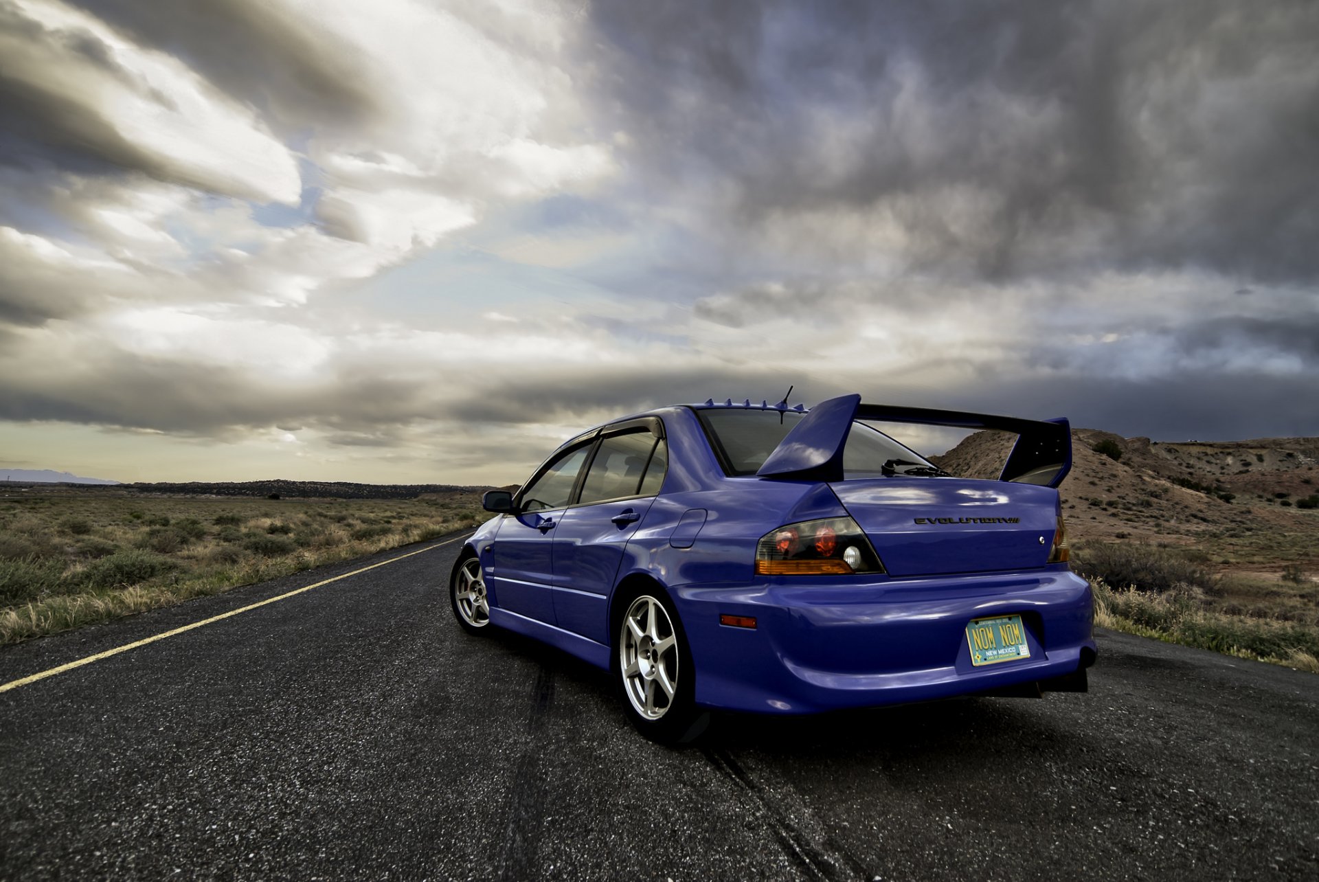 mitsubishi lancer evolution viii blue back of sky clouds body reflection