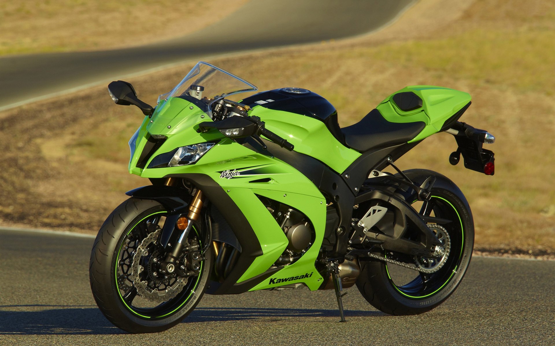 Sporty green motorbike on the track