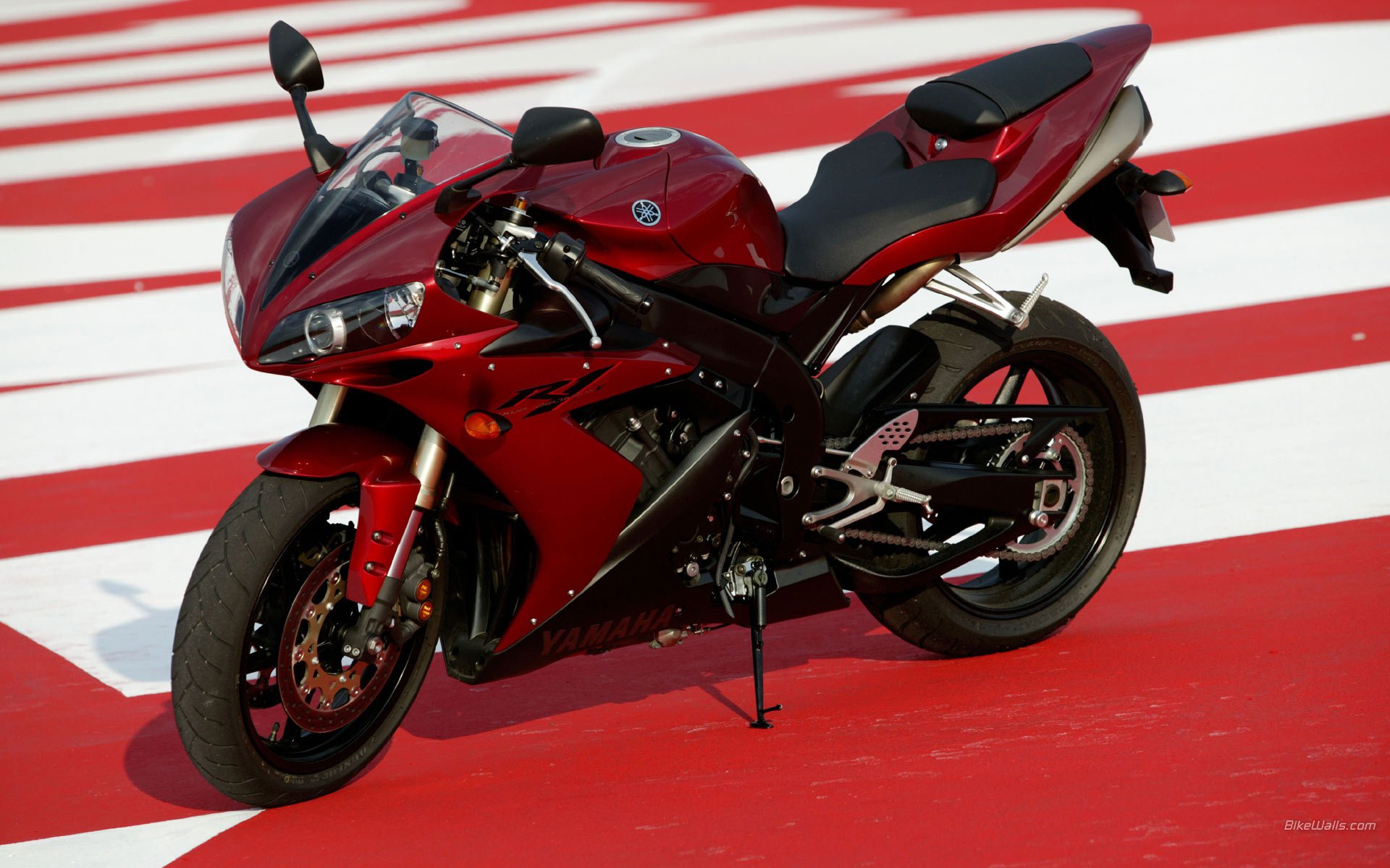 Red sport bike on a red-white background