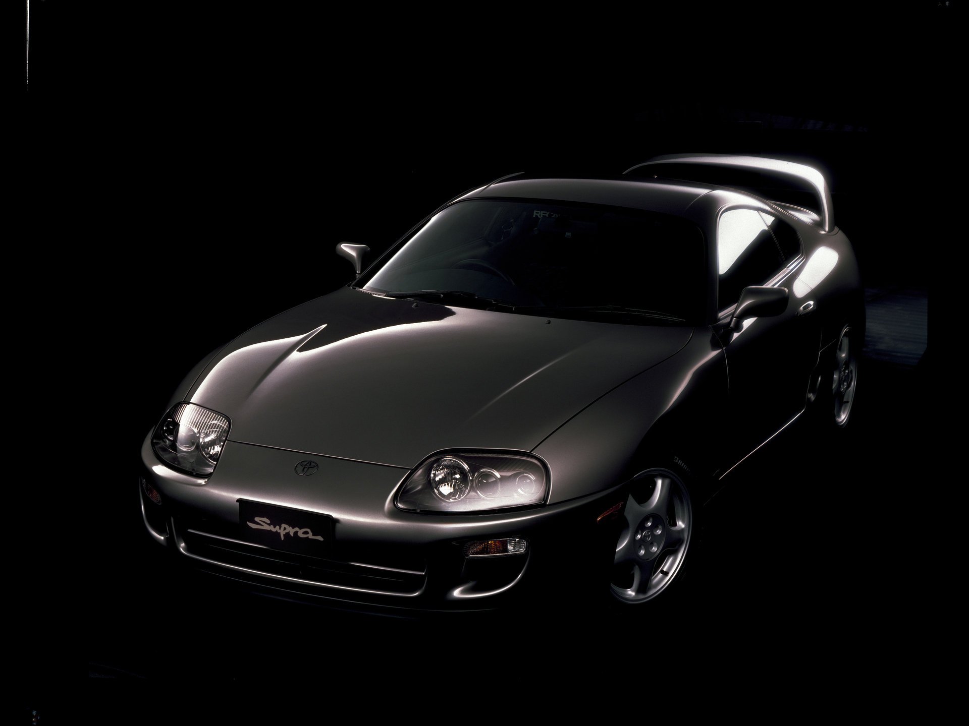 Black Toyota Supra on a black background