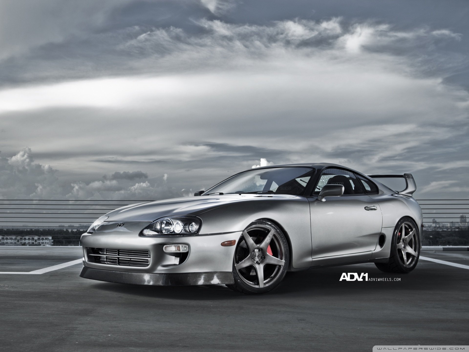 Silver Toyota Supra at the stadium