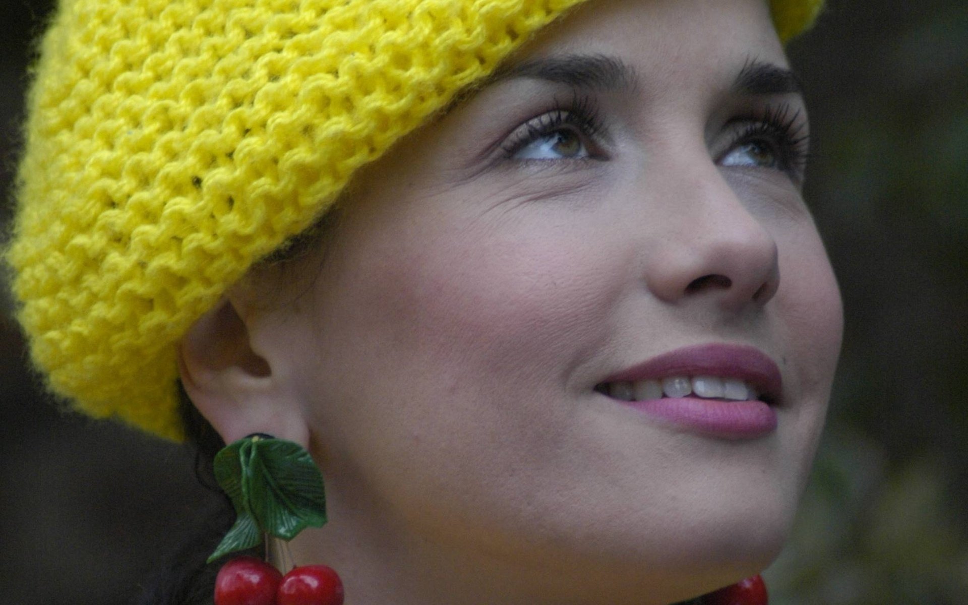 Romantic girl in a knitted yellow beret