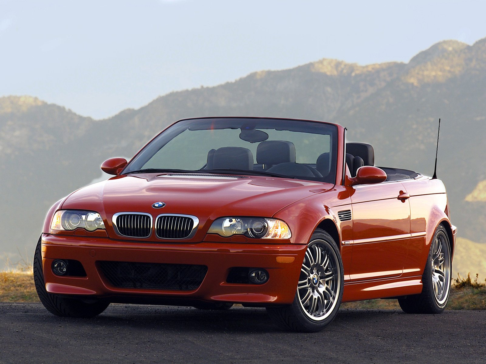 Red bmw e46 convertible in the mountains