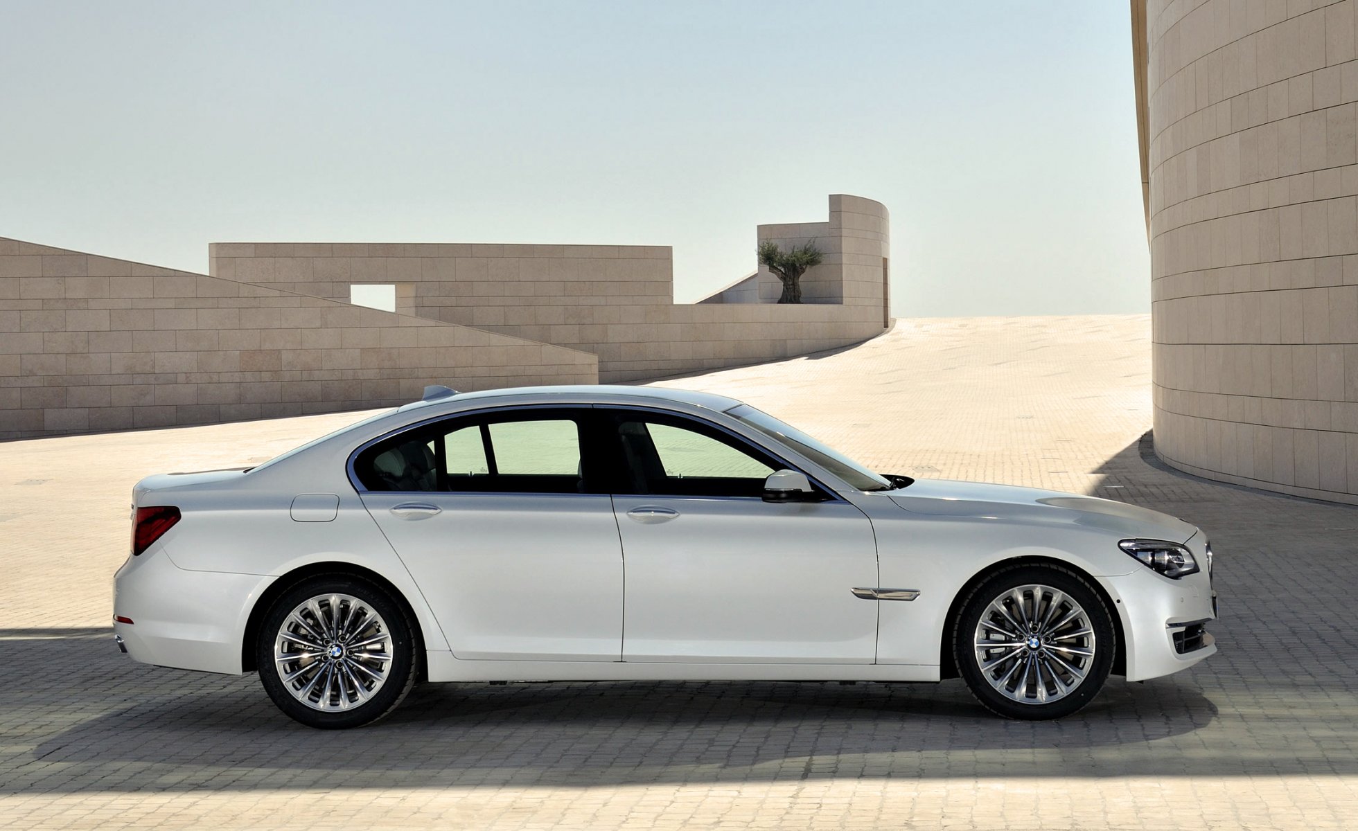 bmw 7 series machine a side view day boomer car sedan white