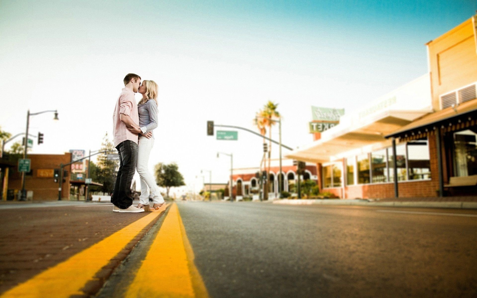 Two lovers on the road marking. gentle embrace of a man and a woman. shooting in love