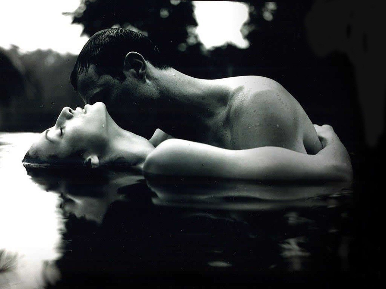 Couple in love nude in water black and white