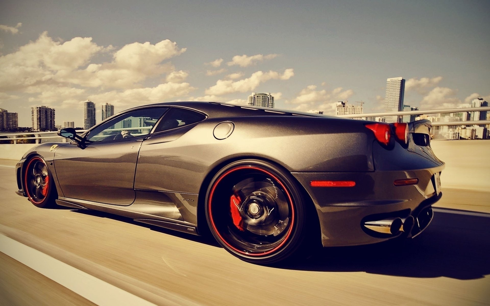Sports car on the background of the sky and the city