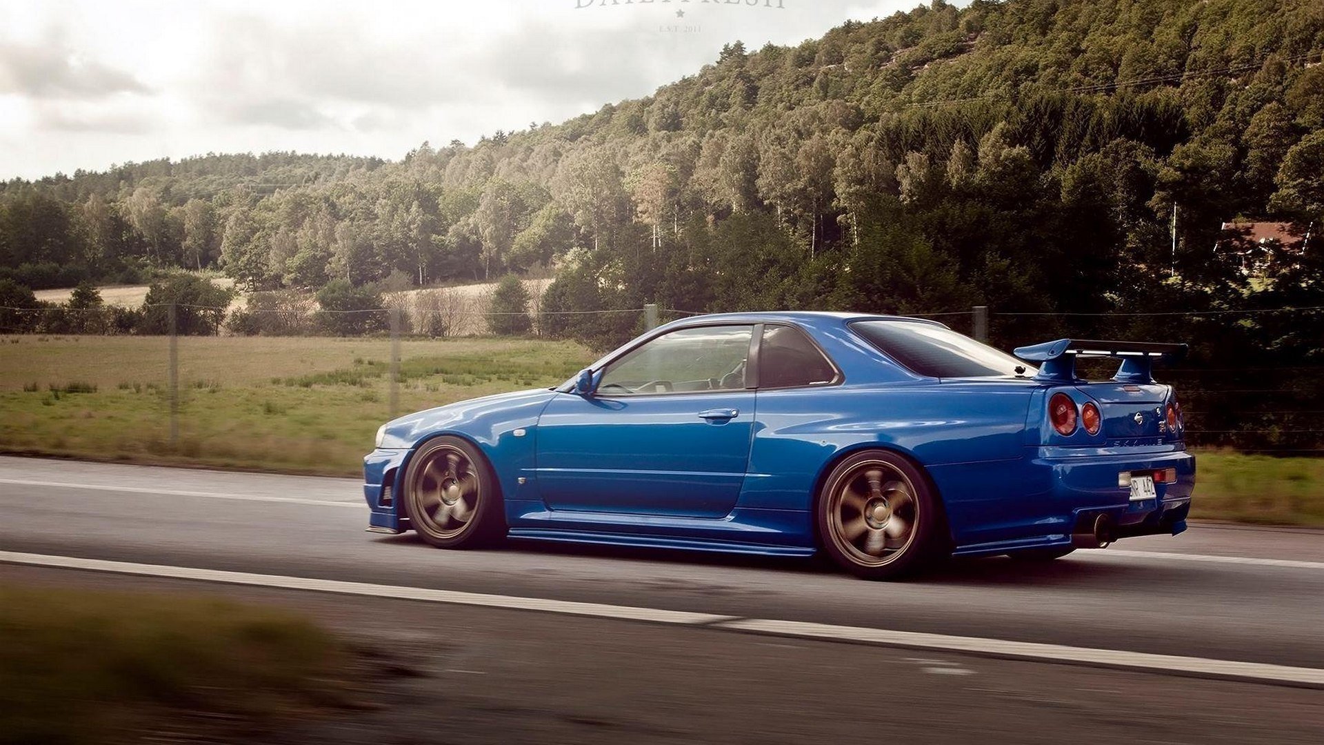 nissan skyline r34 gtr car machine blue road tree forest