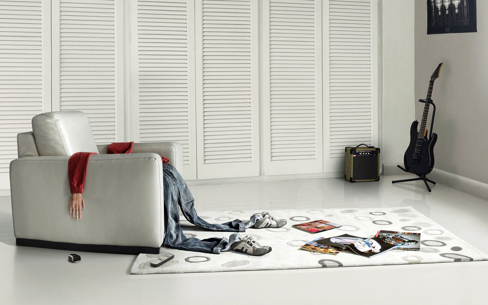 A man took off his suit in a white room