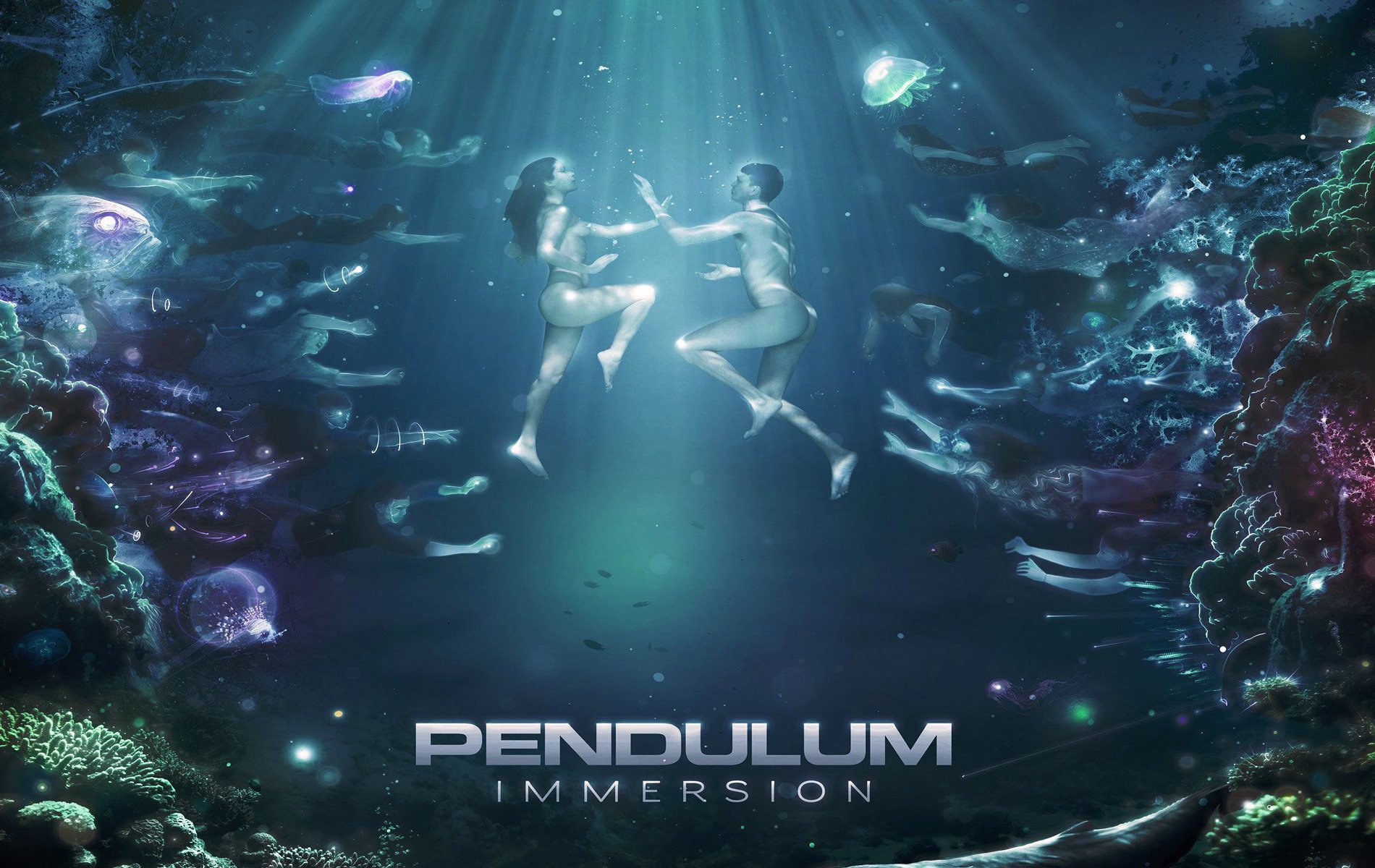 Underwater, he and she swim among the corals