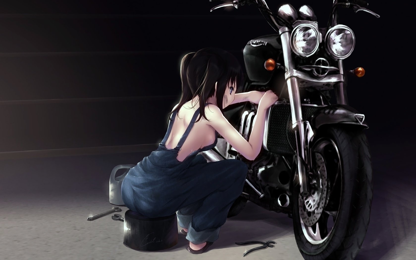 A beautiful girl repairs a motorcycle