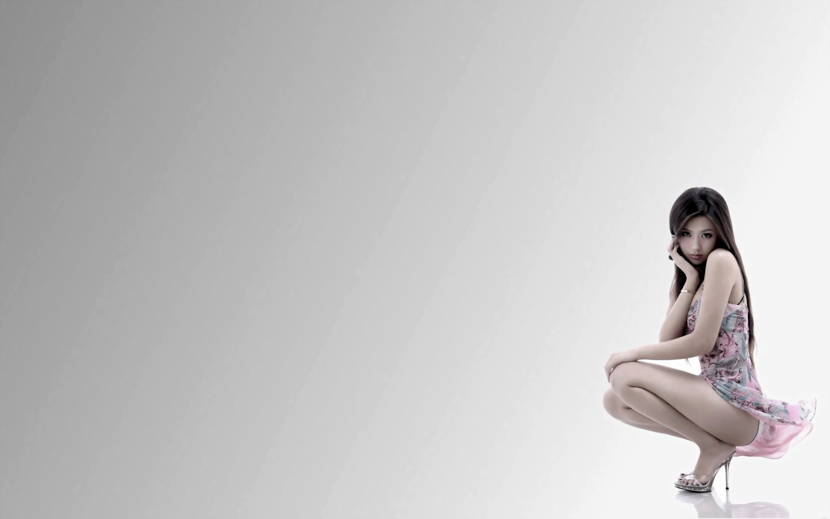 Beautiful girl in stilettos sitting