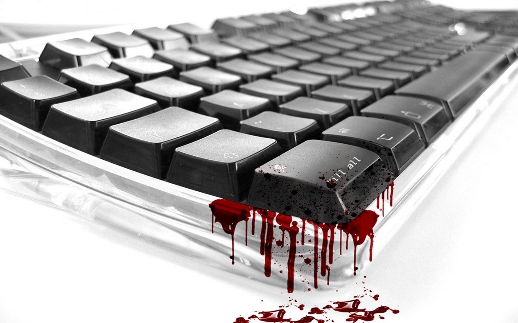 Black keyboard with drops of blood on a white background