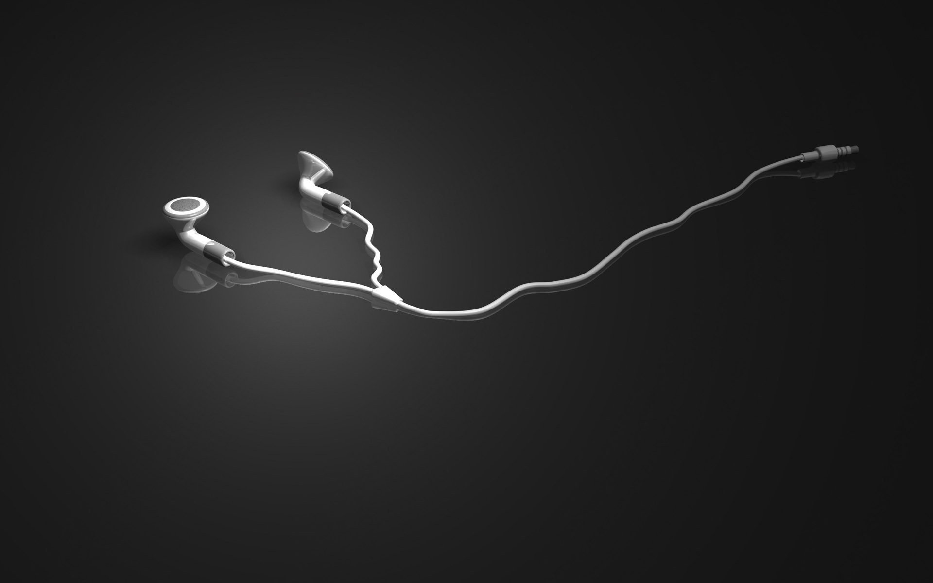 White headphones lie on a mirrored gray background