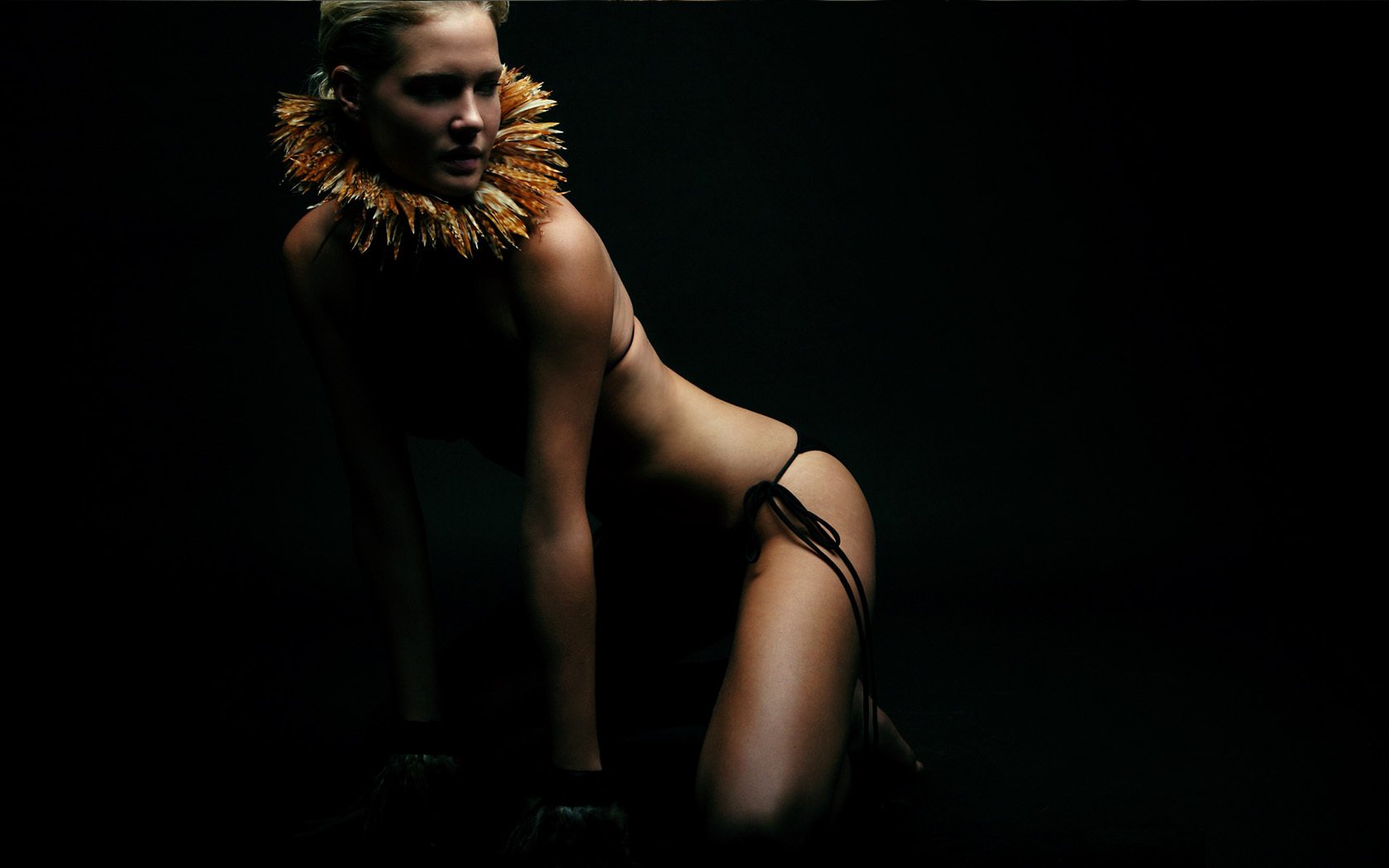 Sexy girl in the twilight with a hoop around her neck