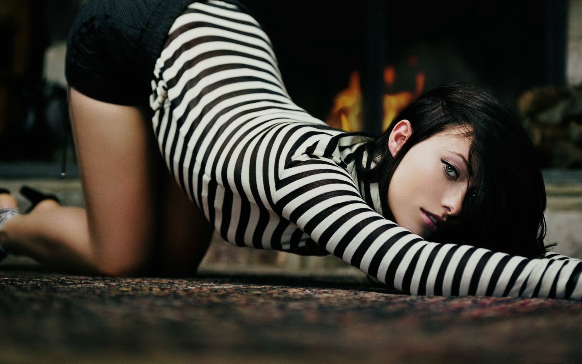 A girl in a vest in a sexy pose