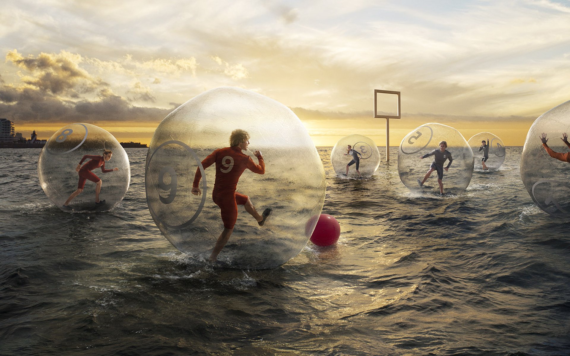 A comic match of football players on the water in balloons