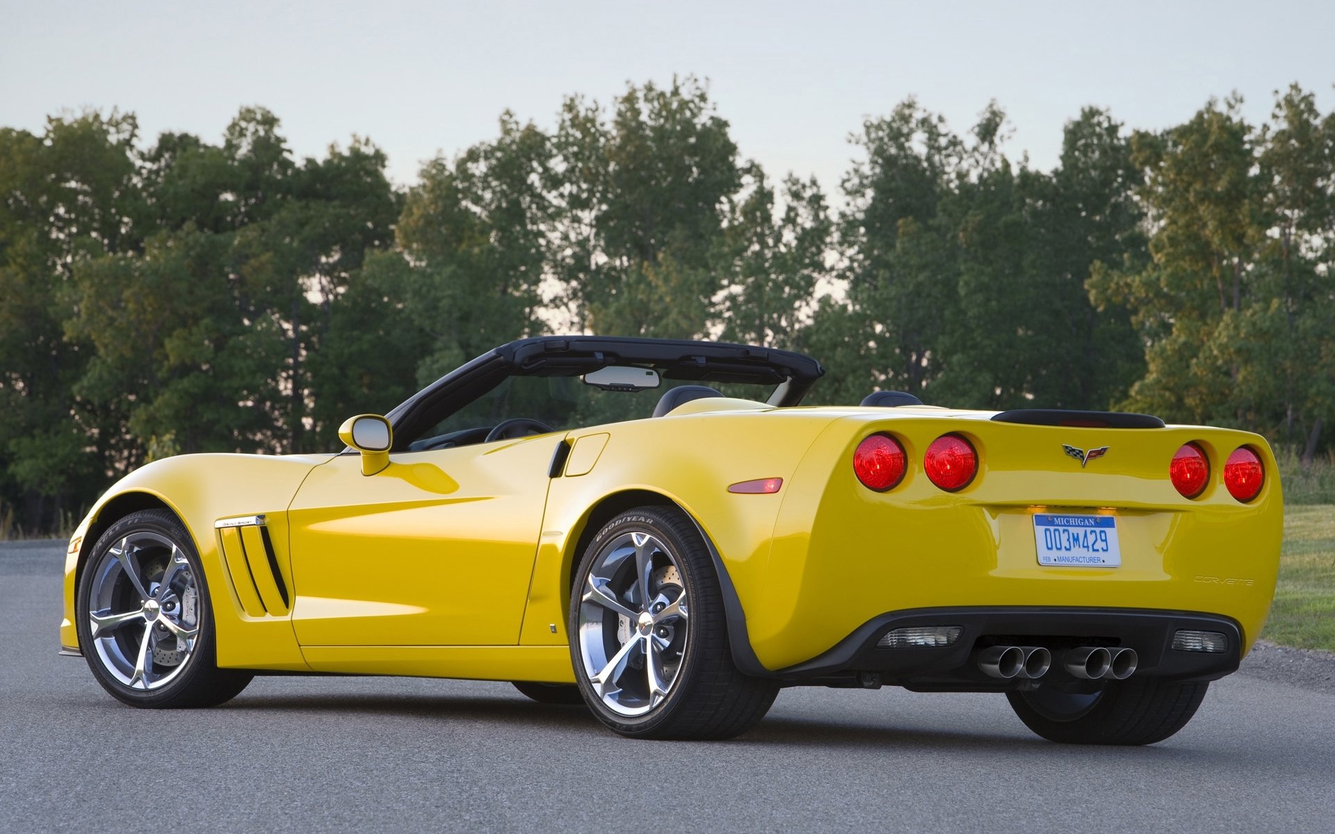 chevrolet corvette grand sport convertible supercar yellow rear view road tree