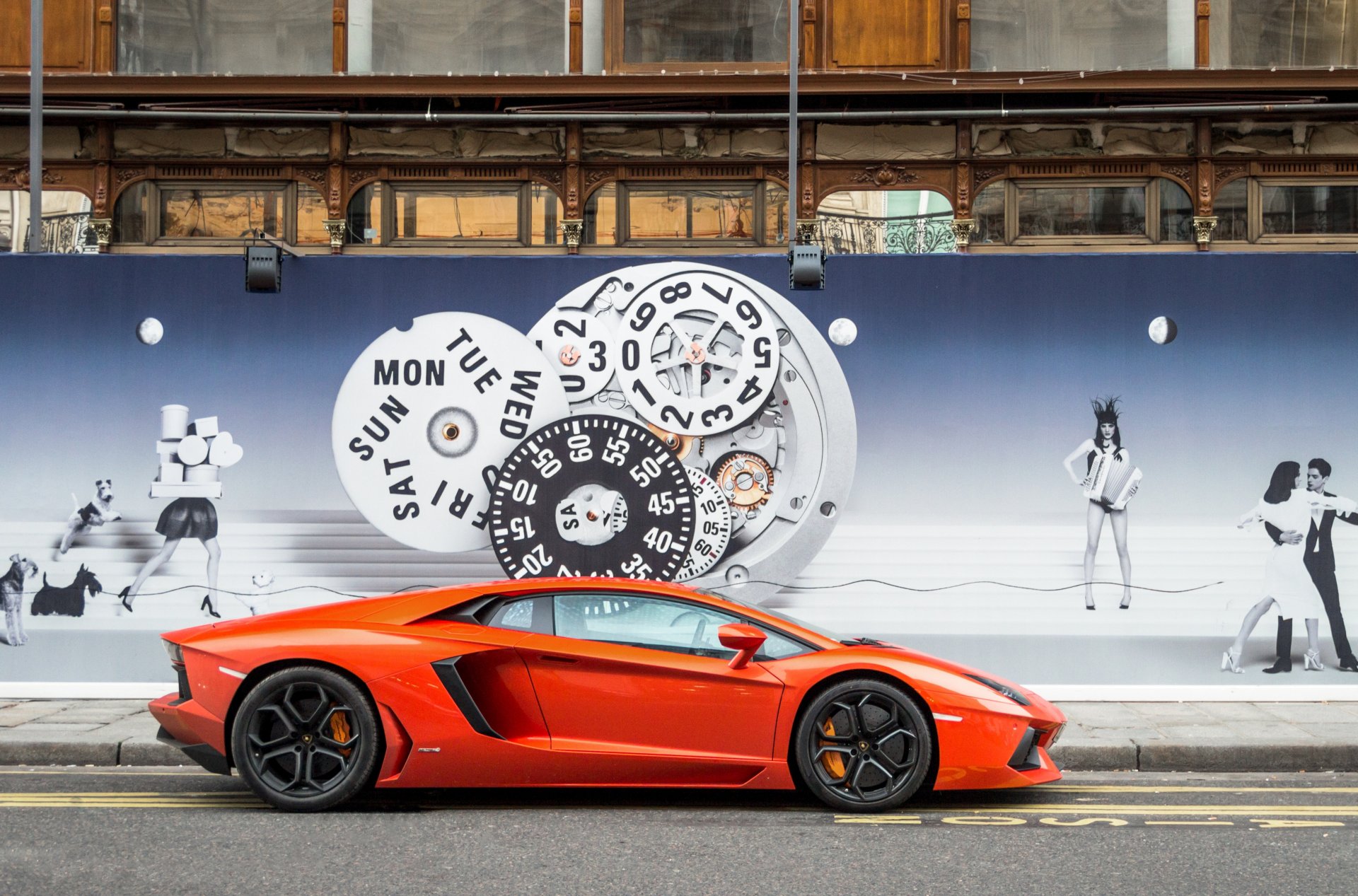 lamborghini aventador lp700-4 orange section curb pavement wall image