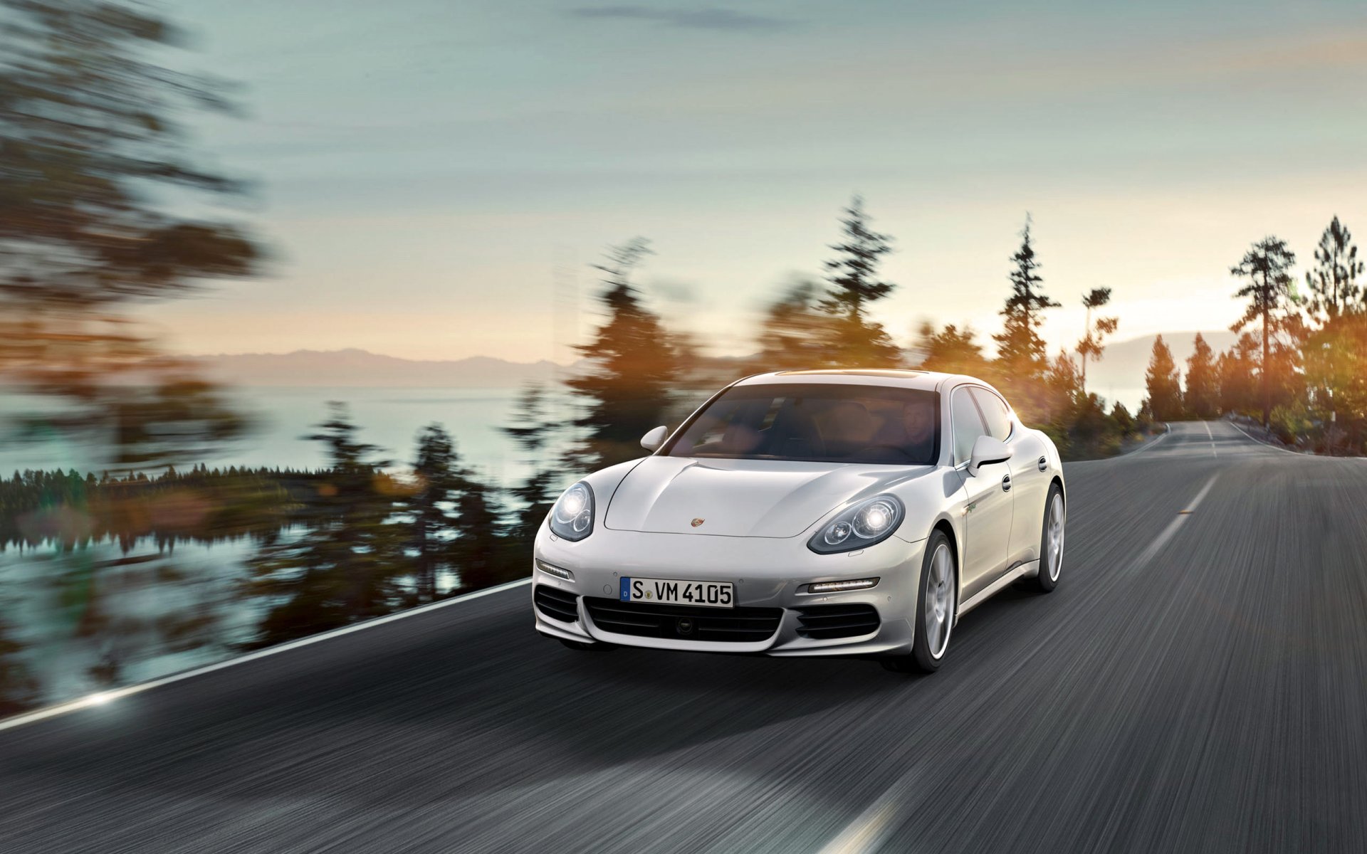 porsche panamera e-hybrid car white road in motion hood light