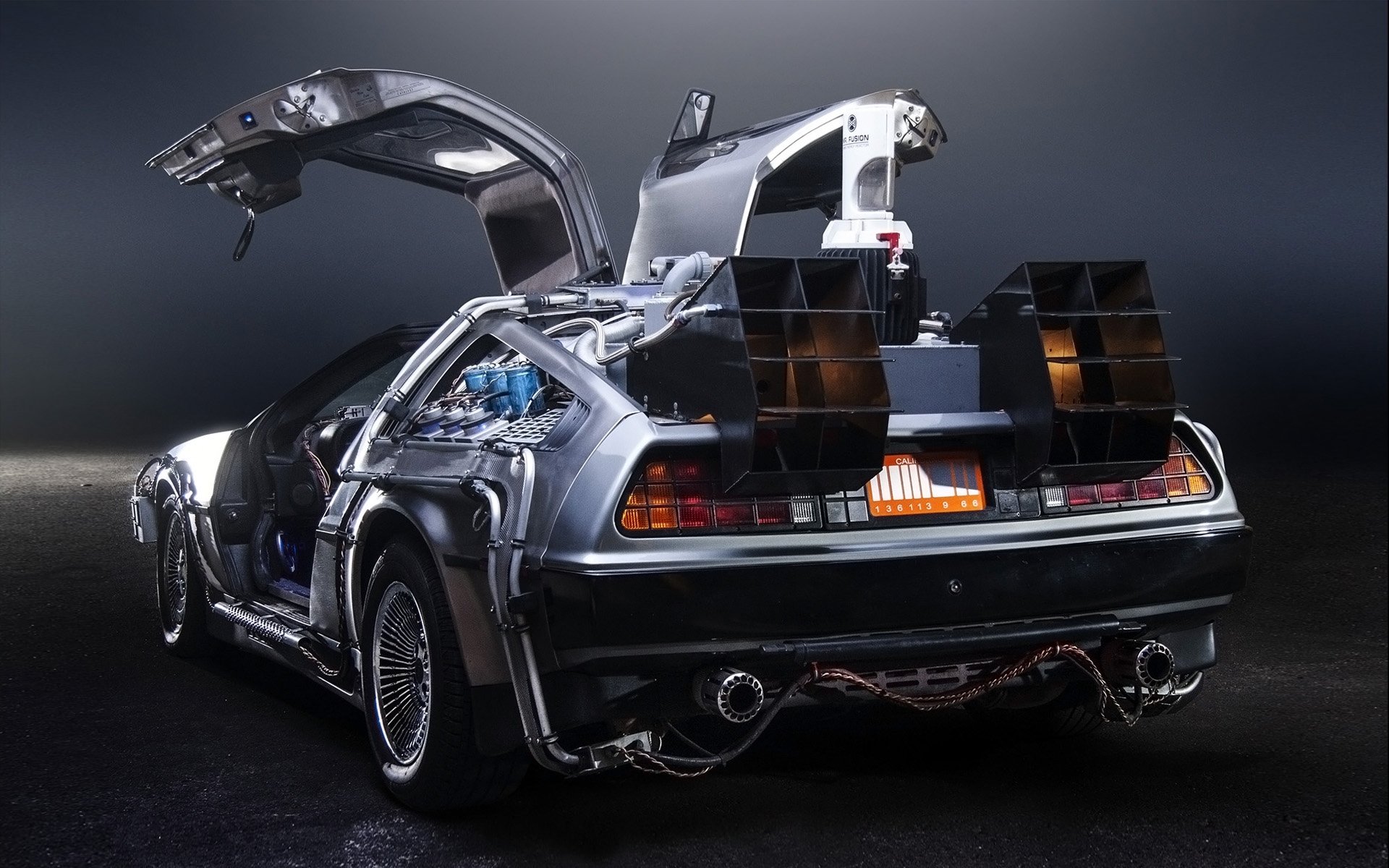 delorean dmc-12 back to the future time machine rear view exhaust doors background