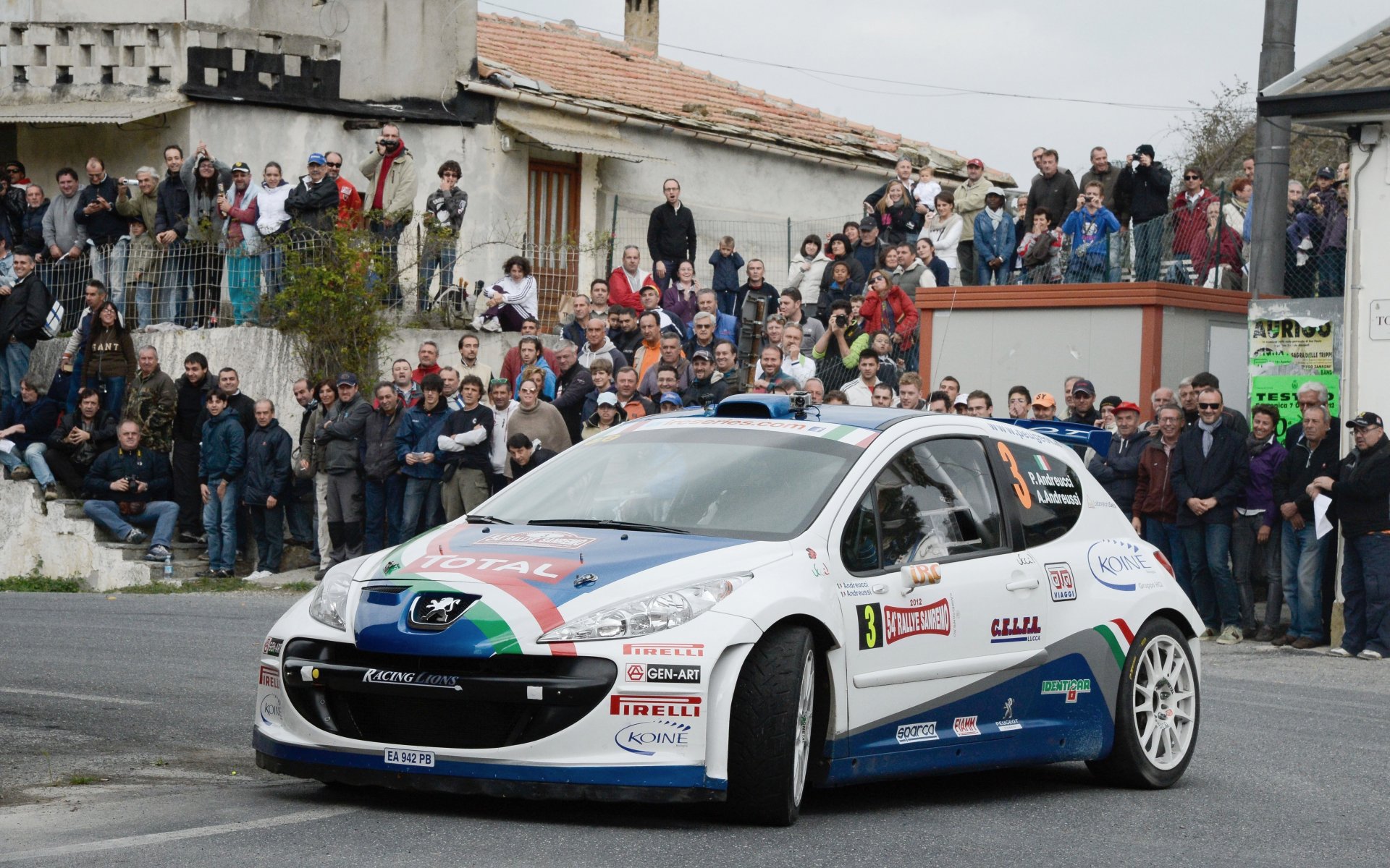 peugeot rally wrc road front people town fans