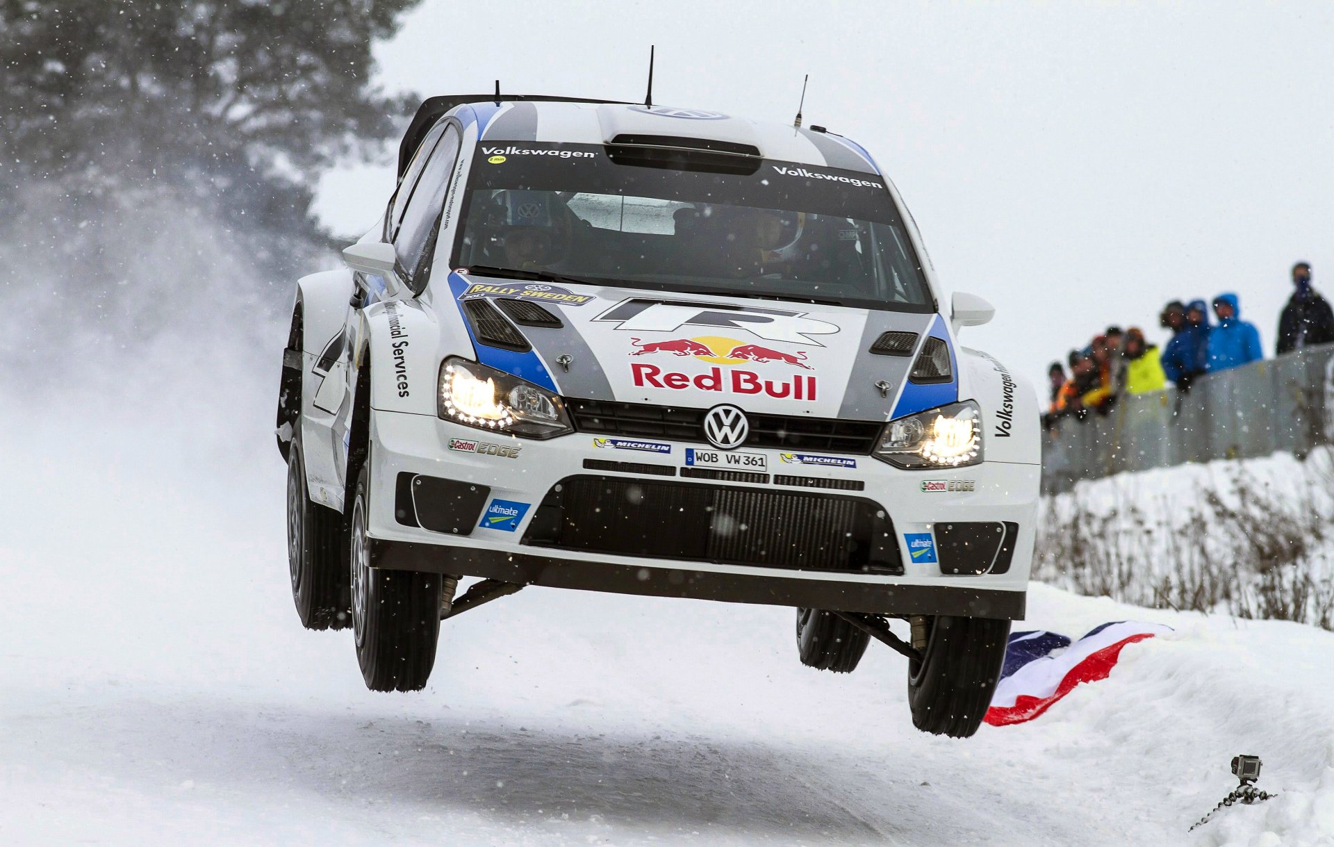 volkswagen polo wrc rally sports machine snow winter white red bull sebastien ogier julien ingrassia in the air flies people light
