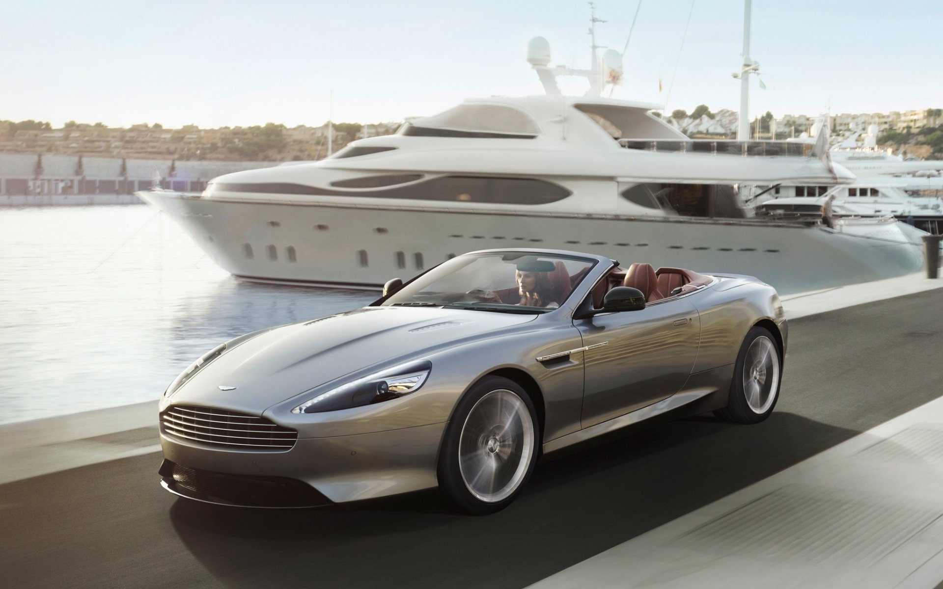 aston martin db9 volante aston martin.db9 convertible front girl embankment yacht background