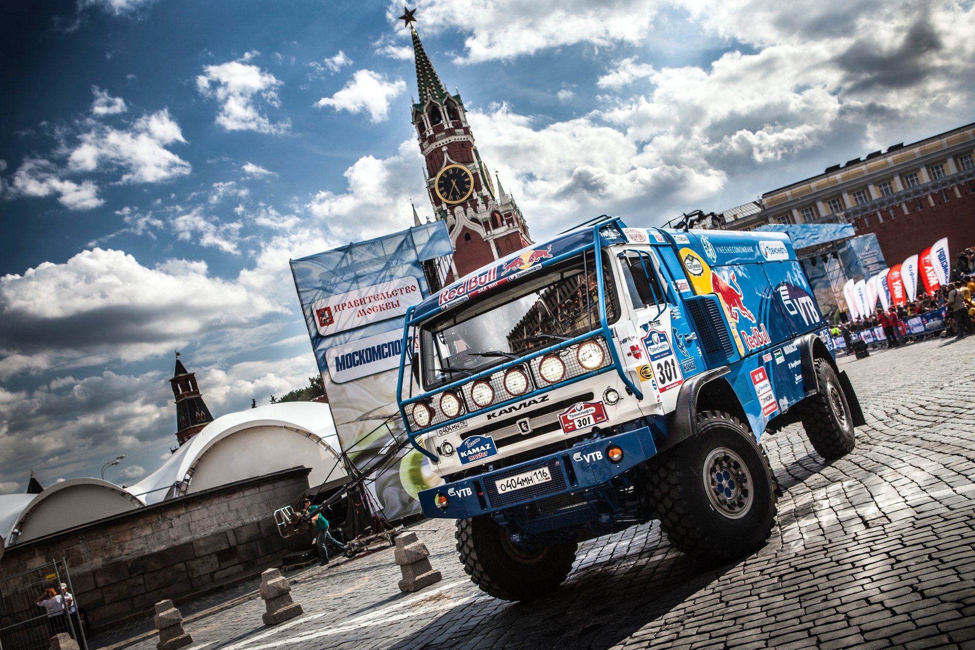 kamaz truck to dakar blue red bull car machine sports day dakar rally front town moscow paving sky clouds