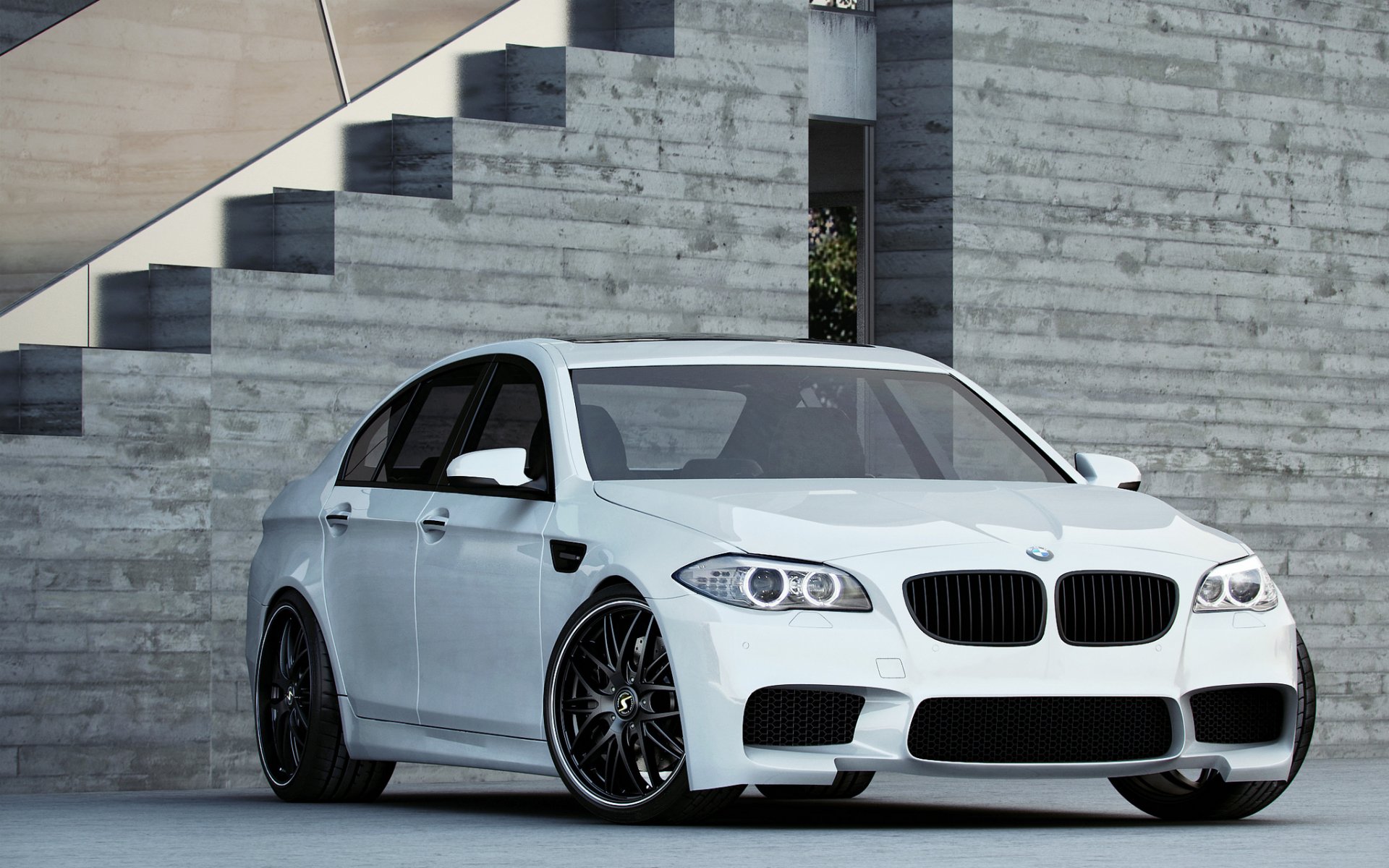 bmw m5 f10 white sports sedan daylight gray building