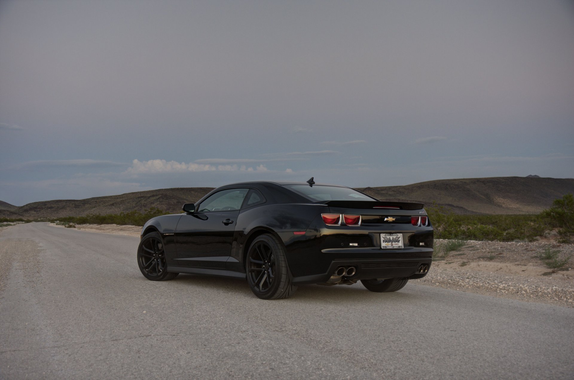 chevrolet camaro zl1 black wheels rear view black wheels road grass slope skyline