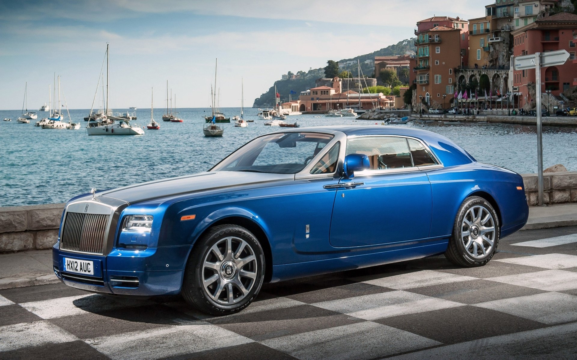 rolls-royce phantom coupe rolls blue front luxury car embankment water yacht sky background